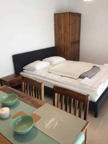 Ένα ή περισσότερα κρεβάτια σε δωμάτιο στο Kropla Bałtyku Darłówko Apartament ECCO