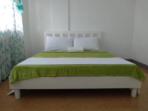 Postel nebo postele na pokoji v ubytování Diodeth's Holiday Apartments