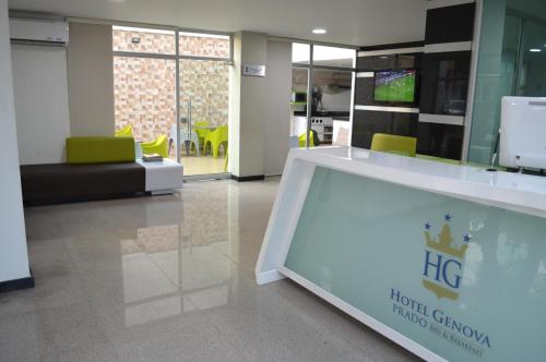 a lobby with a large glass display in a building at Hotel Genova Prado in Barranquilla