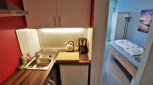 Kuchyň nebo kuchyňský kout v ubytování Apartment Weinsberg