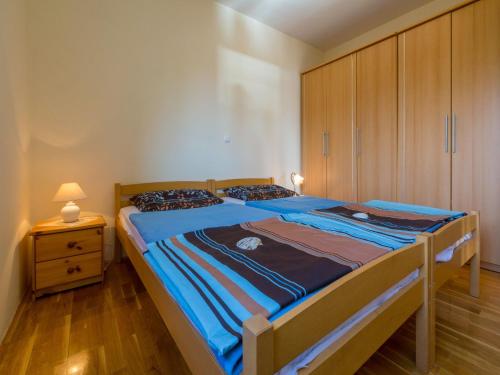Posteľ alebo postele v izbe v ubytovaní Apartments ROKO