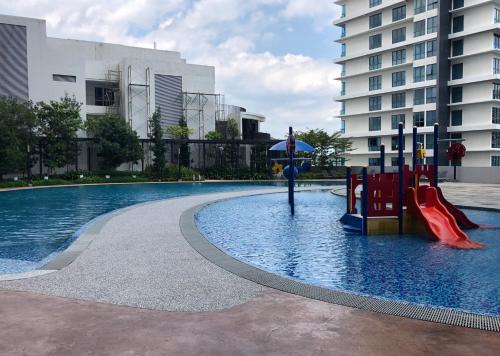 a pool with a playground in the middle of a building at LEGOLAND - 1-8 Pax Lego themed house with Superhero, Pirates & Forest at Puteri Harbour in Johor Bahru