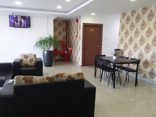 a living room with a couch and a table at Shobi Hotel Johor Bahru Near CIQ JB in Johor Bahru