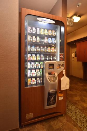a drink vending machine in a room at La Vista Furano Hills Natural Hot Spring in Furano