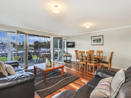 a living room with a couch and a table at Johanssons Perch 1 in Port Fairy