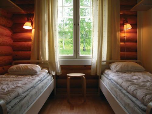 Postel nebo postele na pokoji v ubytování Marttinen