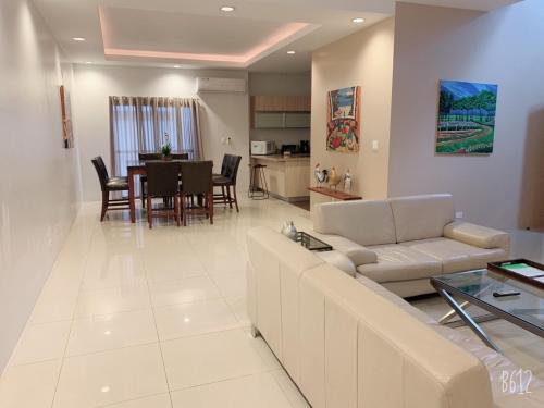 a living room with a couch and a table at Tumon Bel-Air Serviced Residence in Tumon