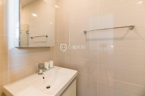 a bathroom with a white sink and a shower at Price 2 Space 4/500m Bts/skytop Pool/mobi Wifi#37 in Bangkok