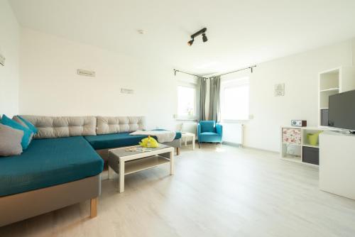 a living room with a couch and a table at FeWo Meersburg in Meersburg