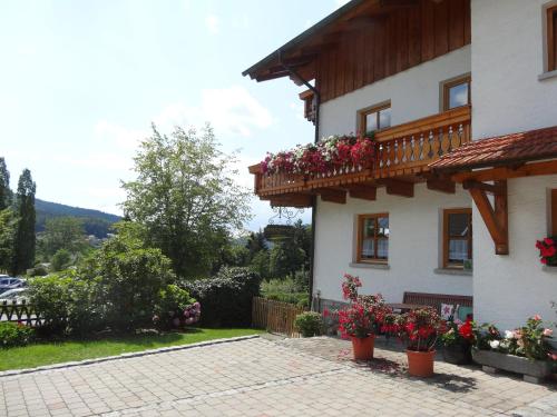 a house with flower pots on the side of it at Haus Seidl in Bodenmais