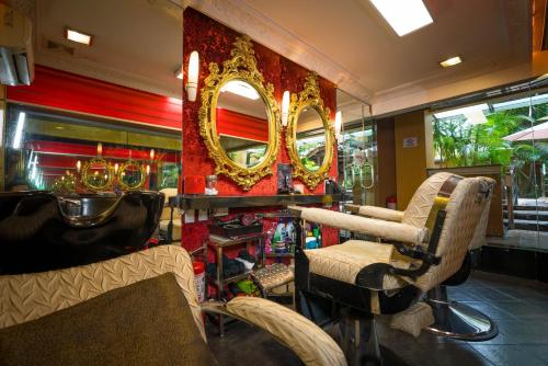 a salon with two chairs and a mirror at ABC Entertainment Resort in Angeles