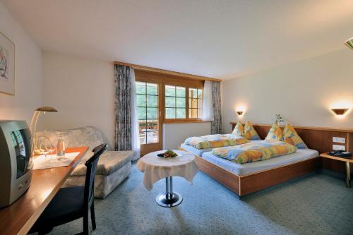 Postel nebo postele na pokoji v ubytování Hotel Ahorni