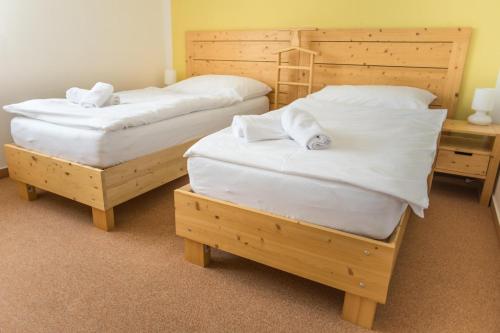 Postel nebo postele na pokoji v ubytování Hotel Relax Vrchbela