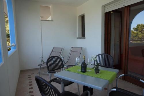 a dining room with a table and chairs at Villaggio Mare Blu in Bibione