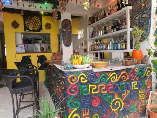 a bar in a restaurant with a colorful counter at Kaiyana Boracay Beach Resort in Boracay