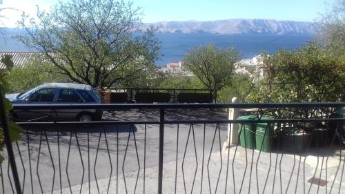 a car parked on the balcony of a house at Apartment Skale in Senj