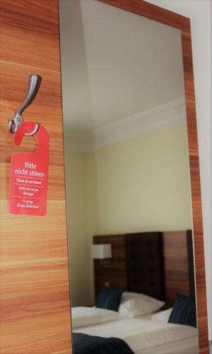Postel nebo postele na pokoji v ubytování Hotel Germersheimer Hof