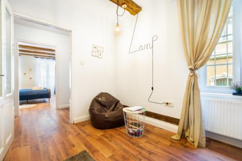 a living room with a couch and a window at Lamp House in Braşov