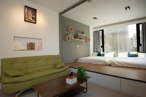 Postel nebo postele na pokoji v ubytování YouI98 Guesthouse一層一戶大坪數套房#本國旅客須先匯款