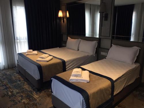 Ein Bett oder Betten in einem Zimmer der Unterkunft Taksim Pera Orient Hotel