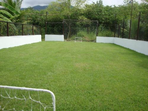 an empty soccer field with a soccer ball in it at Jabaquara Beach Resort in Paraty
