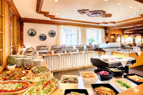 a buffet filled with lots of different types of food at Welcome Hotel Legden in Legden