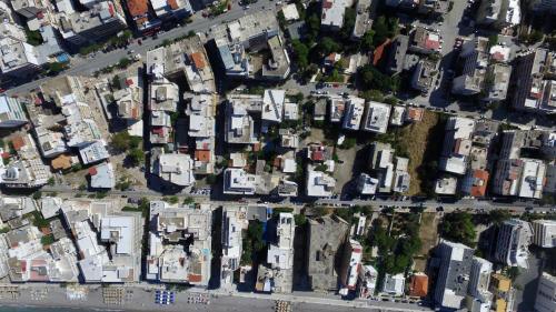 an overhead view of a city with many white houses at Hotel Bakos in Loutraki
