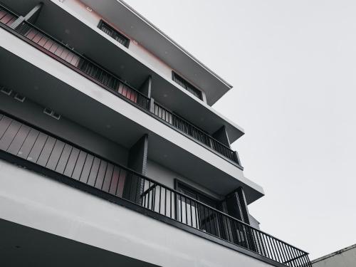 a building with balconies on the side of it at ARUN Riverside Bangkok in Bangkok