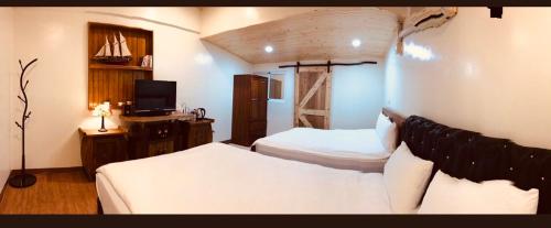 Postel nebo postele na pokoji v ubytování Grace House Homestay 2