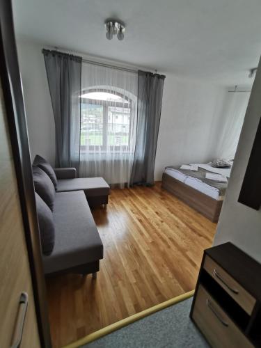 a living room with two beds and a couch at Zamoček in Matiašovce