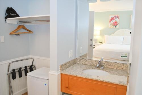 a bathroom with a sink and a toilet at Island House Hotel in Mackinac Island
