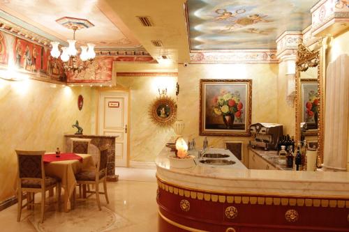 a large room with a kitchen and a dining room at Hotel Boutique Vila Fernando Tirana in Tirana