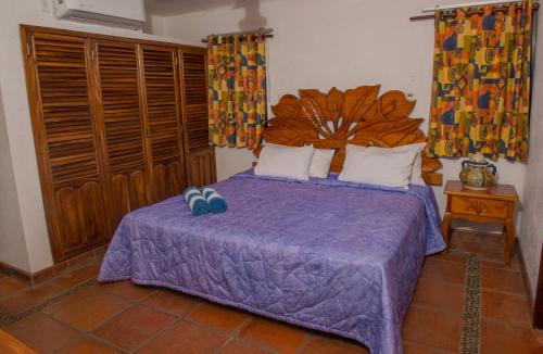 Cama ou camas em um quarto em HOTEL VILLA AZUL