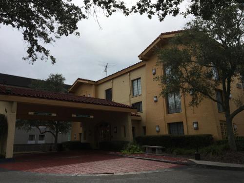 a building with a red brick driveway in front of it at Days Inn by Wyndham Gainesville Florida in Gainesville