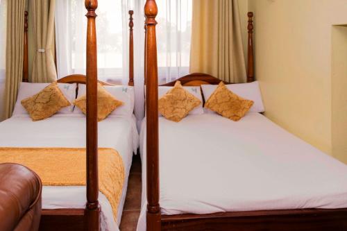 Cama o camas de una habitación en Mountains of the Moon Hotel Fort Portal