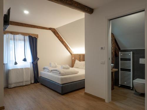 Un pat sau paturi într-o cameră la Valtempo Relais