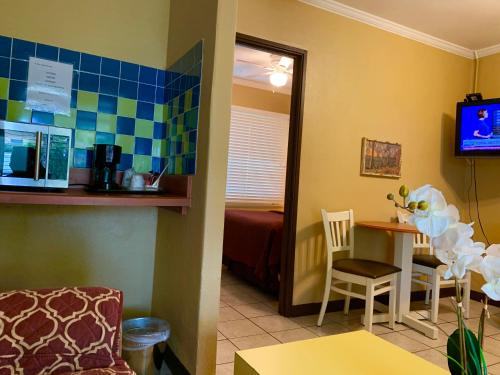 a room with a room with a bed and a table at Lakeside Inn and Cafe in Saint Cloud