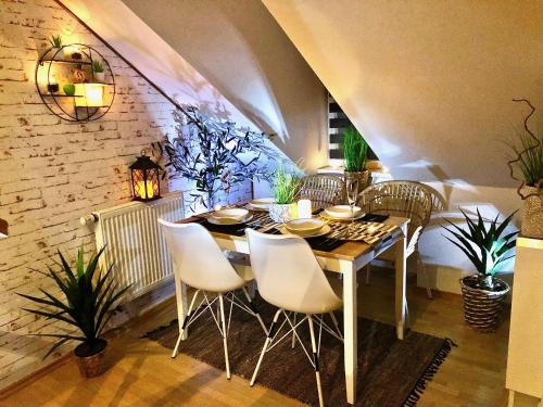 a dining room with a table and chairs at Duplex with quite terrace on Wenceslas sq. in Prague