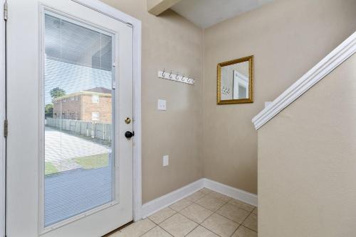 a hallway with a door leading to a balcony at Water Front Delight On The Bay Home in Norfolk