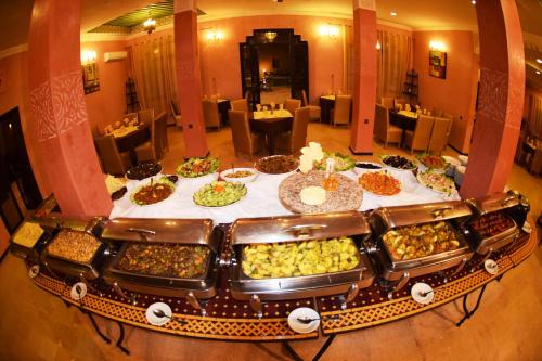 a table filled with different types of food at Palm's Hotel Club in Erfoud