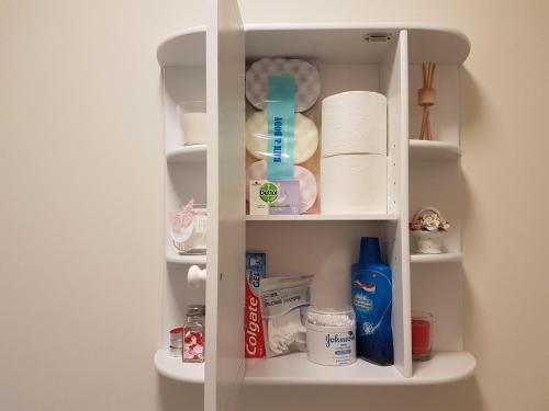 a white cabinet with toiletries and other items in it at Liverpool Anfield in Liverpool