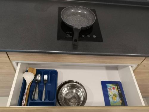 a pot is sitting on top of a drawer at Harmony Studio @ Evo SOHO Bangi in Kampong Sungai Ramal Dalam