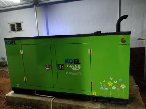 a green utility box sitting in a garage at Raghavi Tourist Home in Kanyakumari