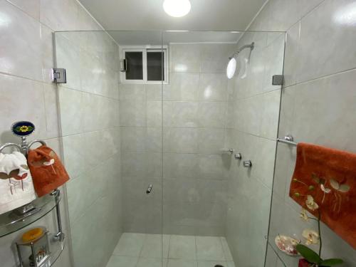 a bathroom with a shower with a glass door at Condominio Renoir in Mexico City