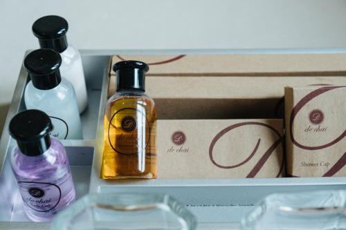 a box with two bottles of soap and a box at De Chai Oriental Nimman - SHA Plus in Chiang Mai
