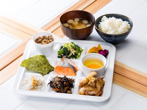 a plate of food with rice and other foods at APA Hotel Yamanote Otsuka Ekimae Tower in Tokyo