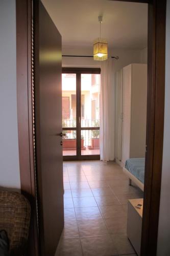 a hallway with a door open to a room at Poseidone Sea Apartment Taormina in Mazzeo