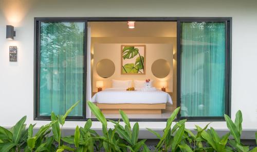 Katil atau katil-katil dalam bilik di Aonang Eco Villa - SHA Extra Plus