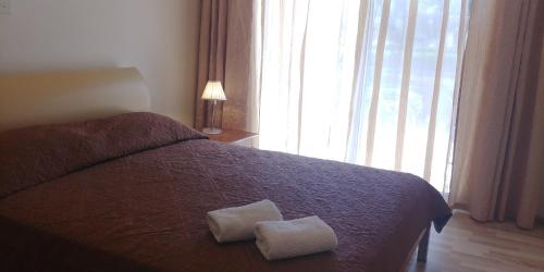 Llit o llits en una habitació de Palm beach 14