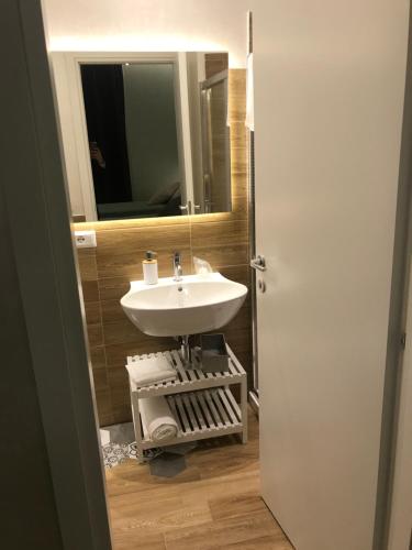 a bathroom with a sink and a mirror at MiraMonti Rooms in Campobasso
